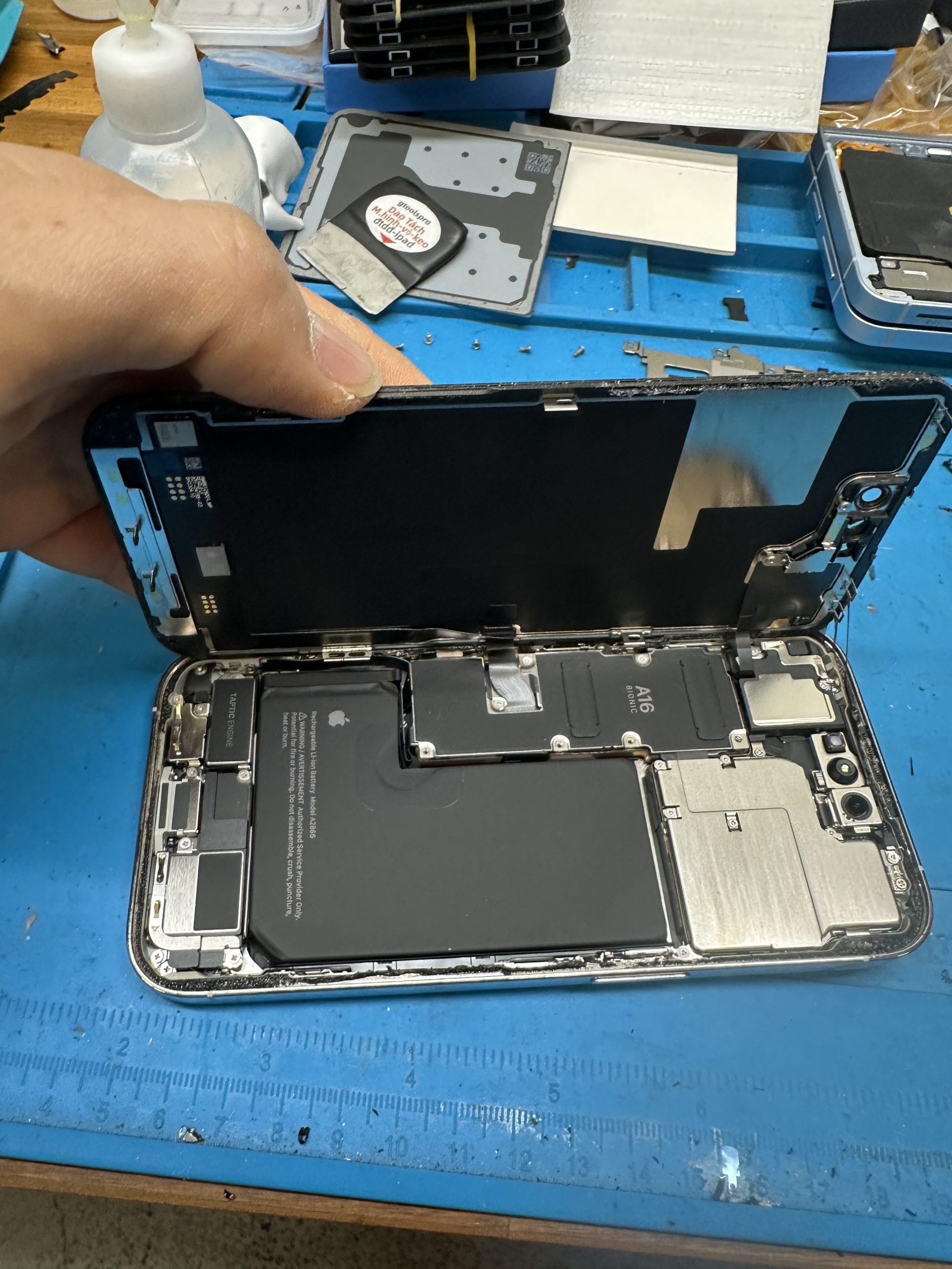Opening the screen to access internal components
